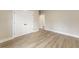 Neutral bedroom with hardwood flooring and a large double door closet at 1110 N Middleton Dr. Nw, Calabash, NC 28467