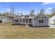 Inviting single-story home with a well-maintained lawn and a classic design that is bathed in sunlight at 1110 N Middleton Dr. Nw, Calabash, NC 28467