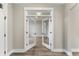 Bright foyer featuring double glass doors and stylish wood-look floors that create a welcoming entrance at 1110 N Middleton Dr. Nw, Calabash, NC 28467