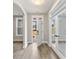 Welcoming foyer featuring light walls, wood-look floors, and views to other rooms through white trim doors at 1110 N Middleton Dr. Nw, Calabash, NC 28467