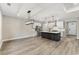 Modern kitchen featuring a large island, stainless steel appliances, and a bright, open layout at 1110 N Middleton Dr. Nw, Calabash, NC 28467