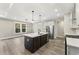 Modern kitchen featuring a center island, stainless steel appliances, and sleek pendant lighting at 1110 N Middleton Dr. Nw, Calabash, NC 28467