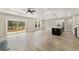 Bright, open living room and kitchen with deck access and modern light fixtures at 1110 N Middleton Dr. Nw, Calabash, NC 28467