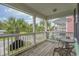 Relax on this cozy balcony, surrounded by lush palm trees and neighborhood views at 113B 13Th Ave. N, Surfside Beach, SC 29575