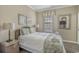Cozy bedroom featuring a wicker bed frame, soft neutral colors, and decorative accents at 113B 13Th Ave. N, Surfside Beach, SC 29575