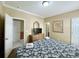 Bright bedroom showcases a patterned bedspread and easy access to ensuite bathroom and hallway at 113B 13Th Ave. N, Surfside Beach, SC 29575