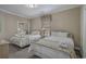 Comfortable bedroom featuring two twin beds, neutral decor, and a mirrored closet at 113B 13Th Ave. N, Surfside Beach, SC 29575