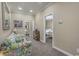 Hallway sitting area leads to bedrooms, offering a relaxing space to unwind at 113B 13Th Ave. N, Surfside Beach, SC 29575