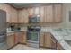 Well-equipped kitchen with stainless steel appliances and granite countertops at 113B 13Th Ave. N, Surfside Beach, SC 29575