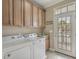 Practical laundry room featuring ample cabinet space, modern appliances, and outdoor access at 113B 13Th Ave. N, Surfside Beach, SC 29575