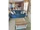 Inviting living room with kitchen views, tile flooring, a blue sofa, and natural light at 113B 13Th Ave. N, Surfside Beach, SC 29575