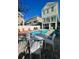 Private backyard with pool, lounge chairs, and outdoor seating, perfect for relaxation and entertaining at 113B 13Th Ave. N, Surfside Beach, SC 29575