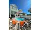 Inviting backyard featuring a kidney-shaped pool, lounge chairs, and ample seating areas, perfect for outdoor entertaining at 113B 13Th Ave. N, Surfside Beach, SC 29575