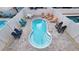 Aerial view of private pool area with ample seating, creating the perfect outdoor oasis at 113B 13Th Ave. N, Surfside Beach, SC 29575