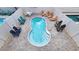 Aerial view of a private pool with lounge chairs and stylish patio furniture creating an inviting outdoor oasis at 113B 13Th Ave. N, Surfside Beach, SC 29575