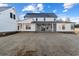 Expansive backyard view of a two-story home with a screened-in porch at 115 S Middleton Dr. Nw, Calabash, NC 28467