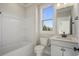 Bathroom featuring a white vanity, toilet, and tub at 115 S Middleton Dr. Nw, Calabash, NC 28467