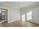 Bedroom with wood floors and a view into an ensuite bathroom at 115 S Middleton Dr. Nw, Calabash, NC 28467