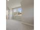 Bright, airy bedroom with plush carpeting, neutral paint, and a window offering natural light at 115 S Middleton Dr. Nw, Calabash, NC 28467