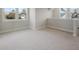 Well-lit bonus room featuring plush carpet and views from multiple windows at 115 S Middleton Dr. Nw, Calabash, NC 28467