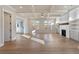 Spacious living room with coffered ceiling, fireplace, and hardwood floors at 115 S Middleton Dr. Nw, Calabash, NC 28467