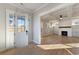 Bright living room with hardwood floors, a fireplace, built-ins, and a coffered ceiling at 115 S Middleton Dr. Nw, Calabash, NC 28467