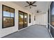 Covered screened porch with ceiling fans and sliding glass doors at 115 S Middleton Dr. Nw, Calabash, NC 28467