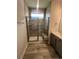 Modern bathroom featuring a tiled shower with glass doors and a built-in bench at 1241 Lady Bird Way, North Myrtle Beach, SC 29582