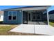 A tranquil screened porch and patio are attached to this cozy, blue single-Gathering house at 1241 Lady Bird Way, North Myrtle Beach, SC 29582