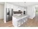 Modern kitchen with stainless steel appliances, a granite island, and stylish pendant lighting at 1241 Lady Bird Way, North Myrtle Beach, SC 29582