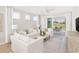 Inviting living room with plush seating, neutral tones, and sliding glass doors to the outside at 1241 Lady Bird Way, North Myrtle Beach, SC 29582