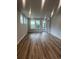 Spacious living room with abundant natural light, durable floors and a door to outside at 1241 Lady Bird Way, North Myrtle Beach, SC 29582