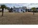 The property has a huge fenced backyard with palm trees and a small patio at 1261 Pineridge St., Conway, SC 29527