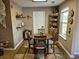 Cozy dining room with warm colors, a wood table, and a window letting in lots of light at 1261 Pineridge St., Conway, SC 29527