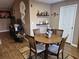 Charming dining area featuring a wooden table, seating for four, and decorative shelves at 1261 Pineridge St., Conway, SC 29527