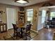 The dining area offers a wooden table, 4 chairs, and a corner display cabinet at 1261 Pineridge St., Conway, SC 29527
