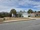 Inviting home with a well-maintained lawn, mature trees, and an attached two-car garage at 1261 Pineridge St., Conway, SC 29527