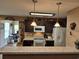 Open kitchen featuring dark cabinets, granite countertops, and modern appliances at 1261 Pineridge St., Conway, SC 29527