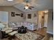 Spacious living room featuring stylish furniture, unique artwork, and a neutral color palette at 1261 Pineridge St., Conway, SC 29527