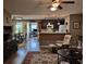 Inviting living room open to the kitchen features wood floors and a relaxing recliner at 1261 Pineridge St., Conway, SC 29527