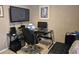 Well-lit office setup with a sleek glass desk and comfortable black rolling chair at 1261 Pineridge St., Conway, SC 29527