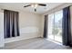 Bedroom with sliding glass doors and gray curtains at 1294 River Oaks Dr. # 6E, Myrtle Beach, SC 29579