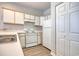 Efficient kitchen featuring white appliances and ample cabinet space at 1294 River Oaks Dr. # 6E, Myrtle Beach, SC 29579
