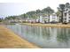 Apartment complex with scenic water views and a tranquil fountain feature at 1294 River Oaks Dr. # 6E, Myrtle Beach, SC 29579