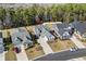 Aerial view of a charming home featuring a landscaped yard, and a neatly manicured lawn at 136 Starlit Way, Myrtle Beach, SC 29579