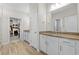 Bright bathroom featuring double vanity with granite counters and a large walk-in closet at 136 Starlit Way, Myrtle Beach, SC 29579