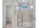 Modern bathroom featuring glass enclosed shower with marble tile and a built-in seat at 136 Starlit Way, Myrtle Beach, SC 29579