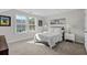 Bright bedroom with neutral walls, carpeted floor, and double windows offering natural light at 136 Starlit Way, Myrtle Beach, SC 29579