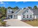 Charming two-story home with a two-car garage, well-maintained landscaping and a welcoming entryway at 136 Starlit Way, Myrtle Beach, SC 29579