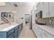 A well-equipped kitchen with stainless steel appliances, an island with seating, and a stylish backsplash at 136 Starlit Way, Myrtle Beach, SC 29579